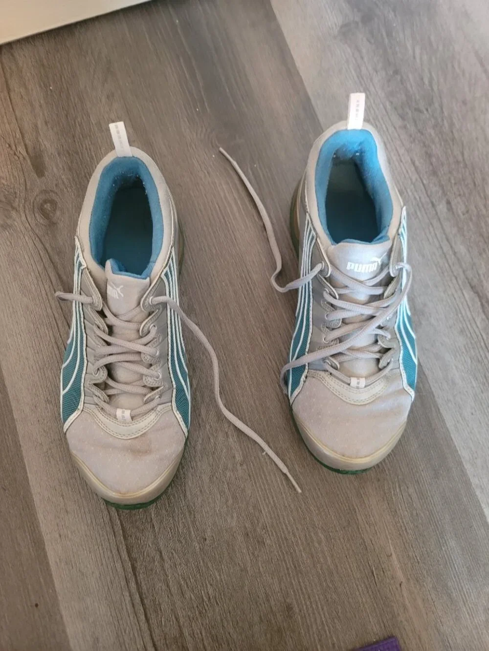 Womens grey and blue puma tennis shoes - has damage - size 10